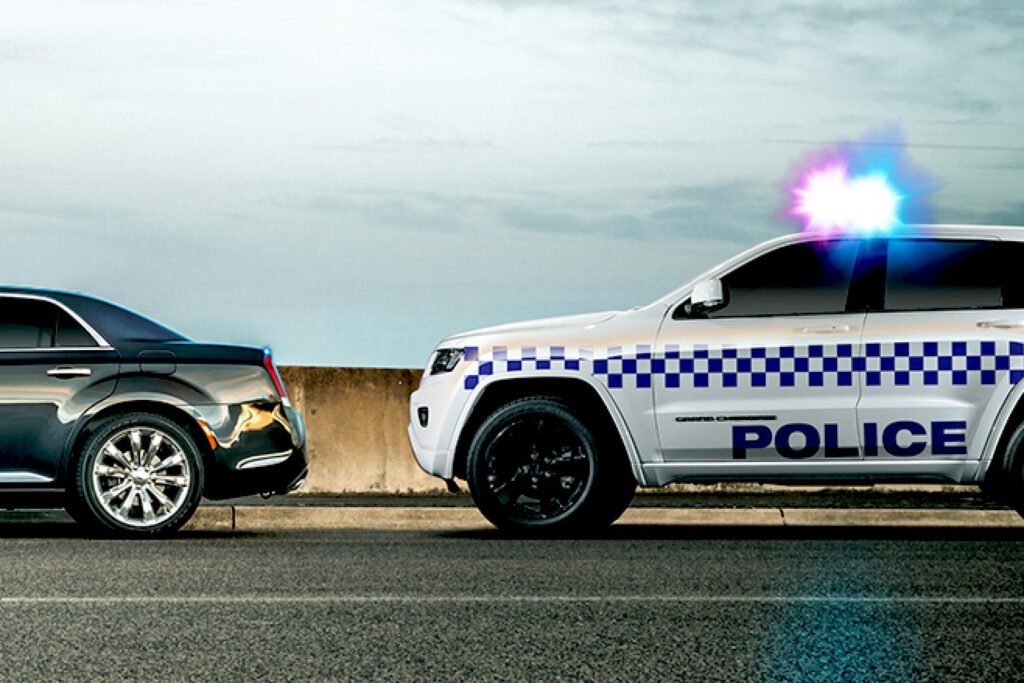 Police pulling over speeding driver