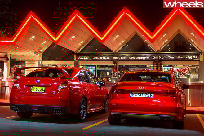 Audi -S3-vs -Subaru -WRX-STi -parked -rear