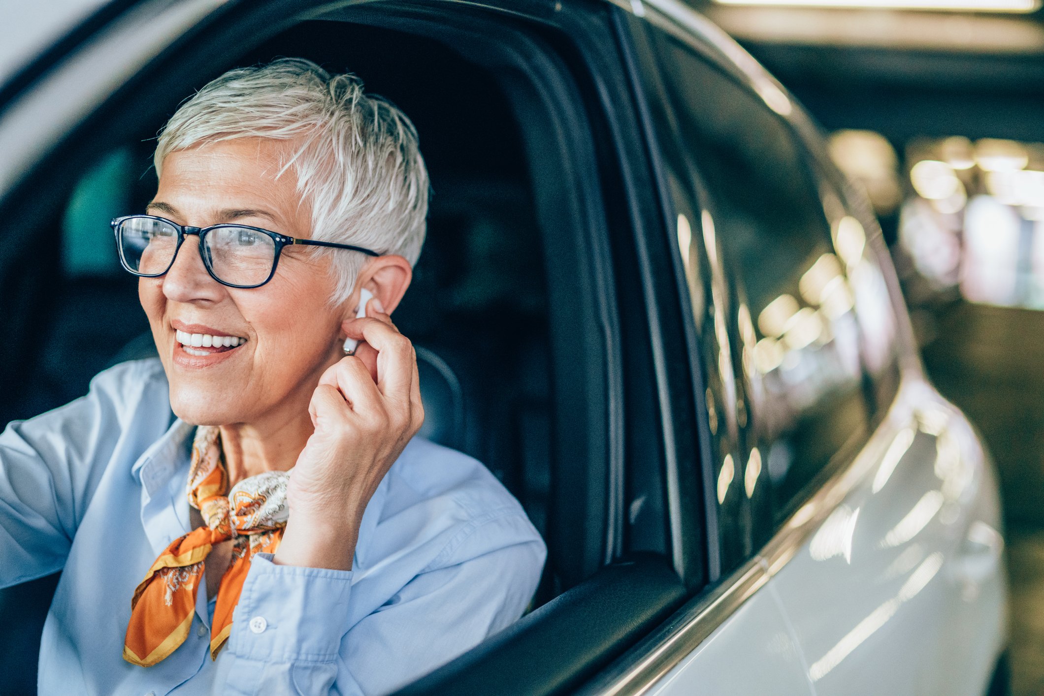 is using airpods in a car illegal