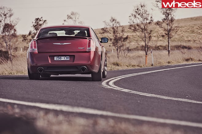 Chrysler -300-SRT8-driving -rear -side