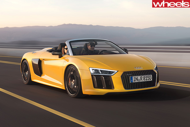Audi -R8-spyder -driving -front -parked -track
