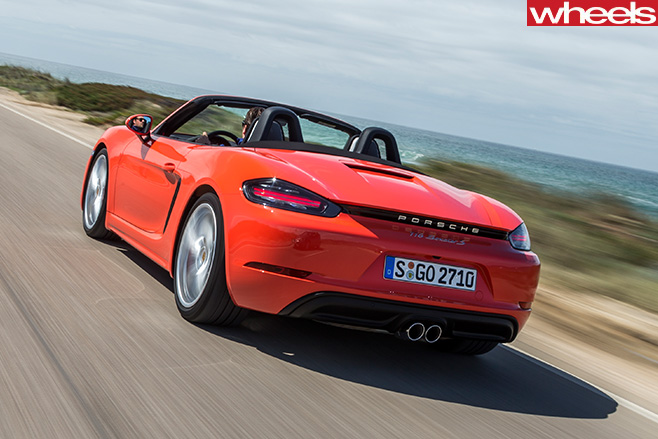 Orange -Porsche -918-Boxster -S-driving -rear