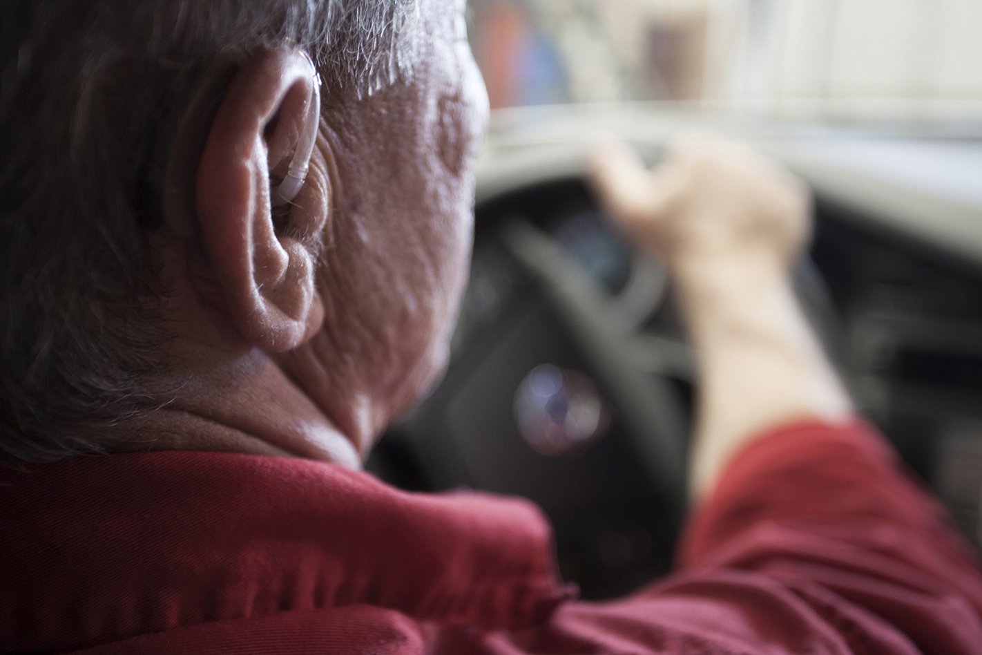 elderly man driving