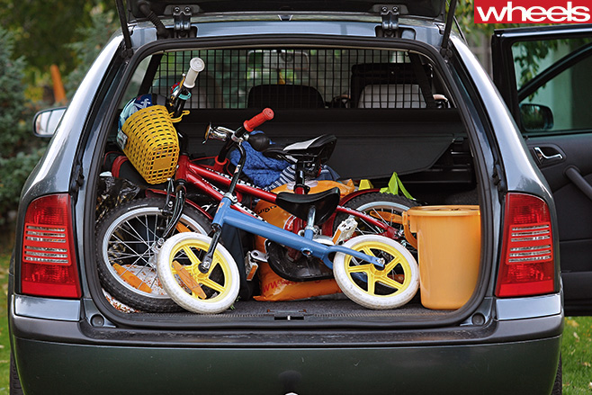 Car boot open and full of equipment