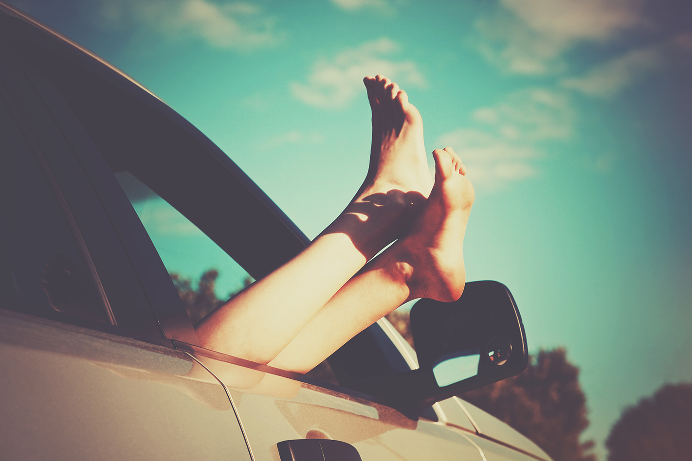 Feet outside car window