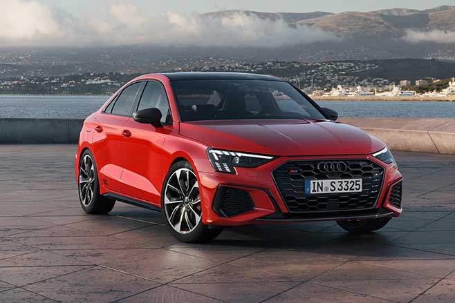 2021 Audi S3 Sedan parked next to a lake.