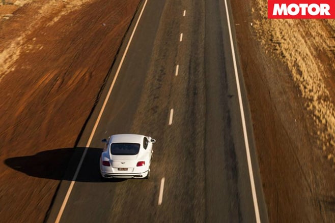 Bentley driving on highway