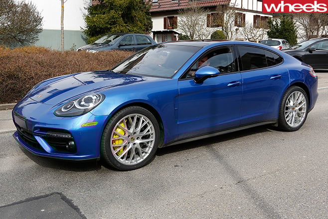 Blue -Porsche -Panamera -driving -on -track