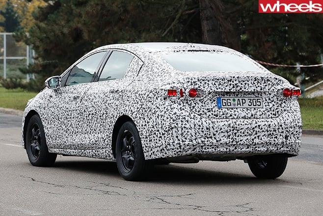 2017-Opel -Astra -sedan -spy -driving -rear -side