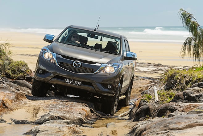 Mazda BT-50 at Fraser Island driving over rocks