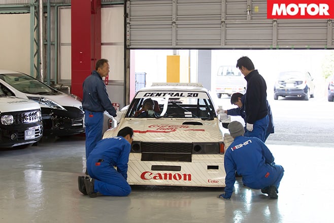 Mechanics work on cars