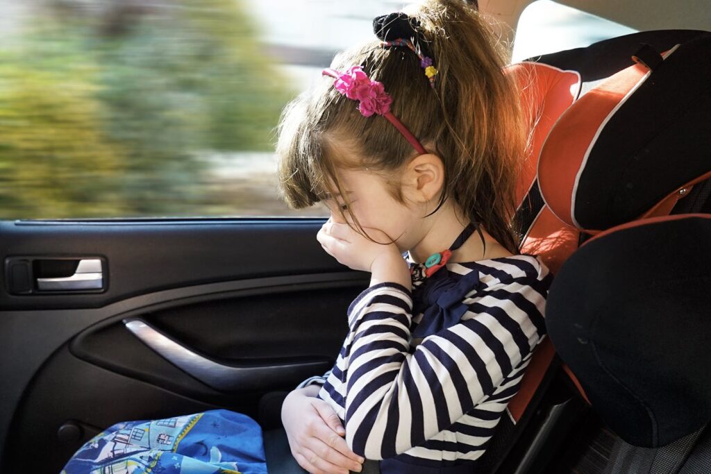 girl sick in car