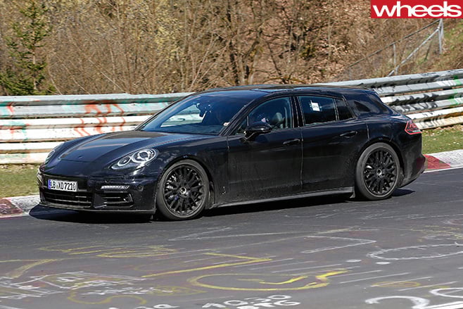 Black -Porsche -Panamera -driving -side