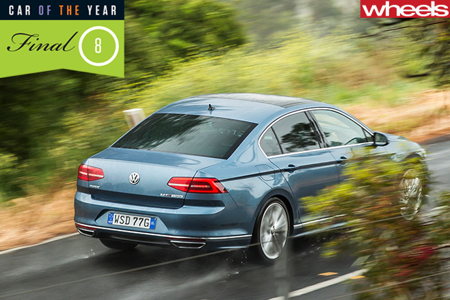 VW-Passat -driving -rear -through -trees