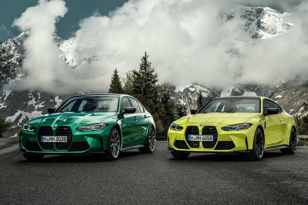 2021 BMW M3 Competition and M4 Competition parked together.