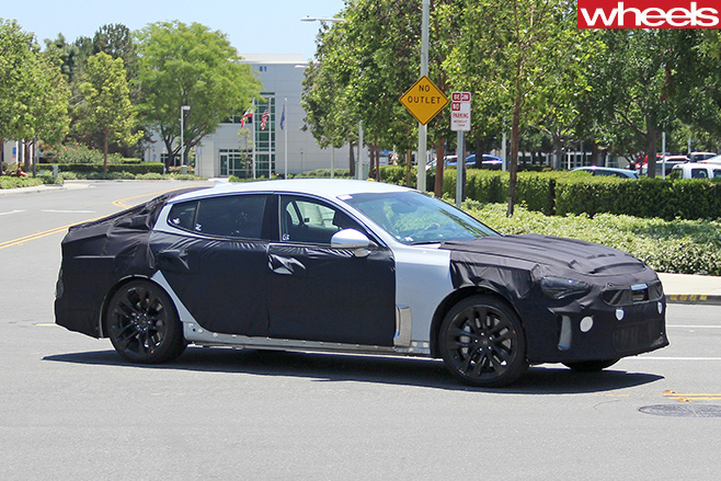 Kia -GT-Sports -Sedan -side -driving