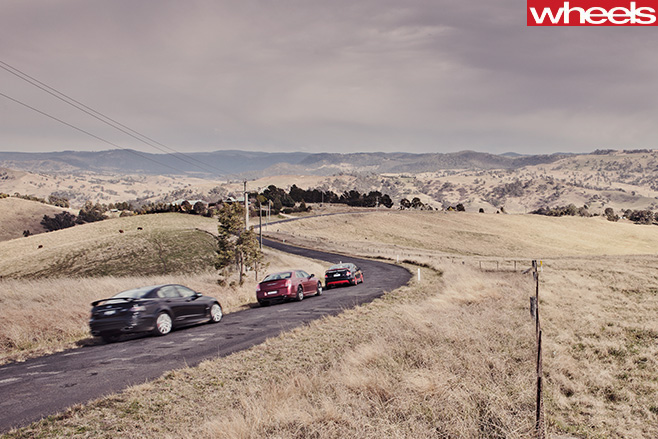 2012-FPV-GT-R-Spec -vs -Chrysler -300-SRT8-vs -HSV-Clubsport -R8-driving -rear -side