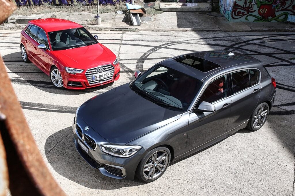 audi s3 vs bmw m140i main 2