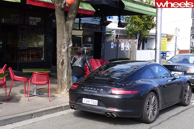 Porsche -911-rear -in -front -of -cafe-