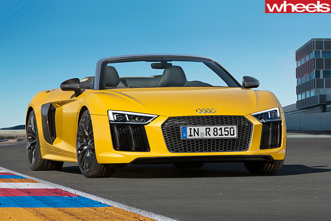 Audi -R8-spyder -driving -front -parked -track