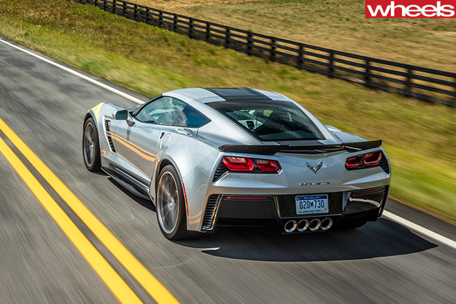 2017-Chevrolet -Corvette -C8-driving -rear -side