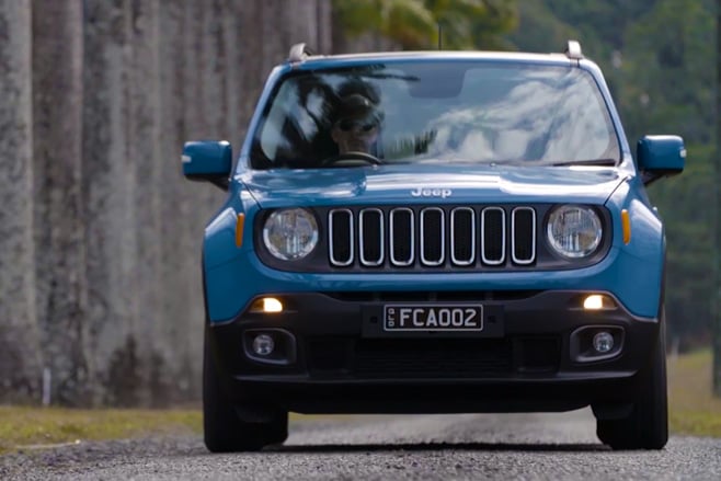 Blue Jeep Renegade driving