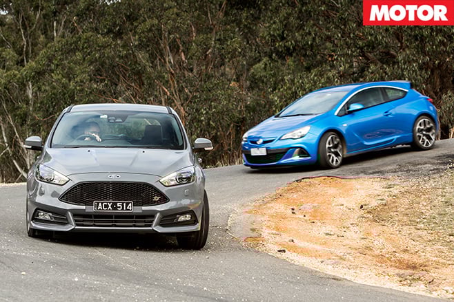 Ford and holden driving downhill