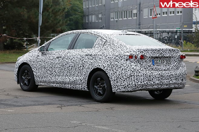 2017-Opel -Astra -sedan -spy -driving -side -rear