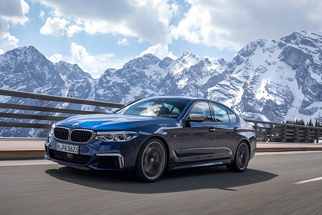 2018 BMW M550d xDrive driving alps