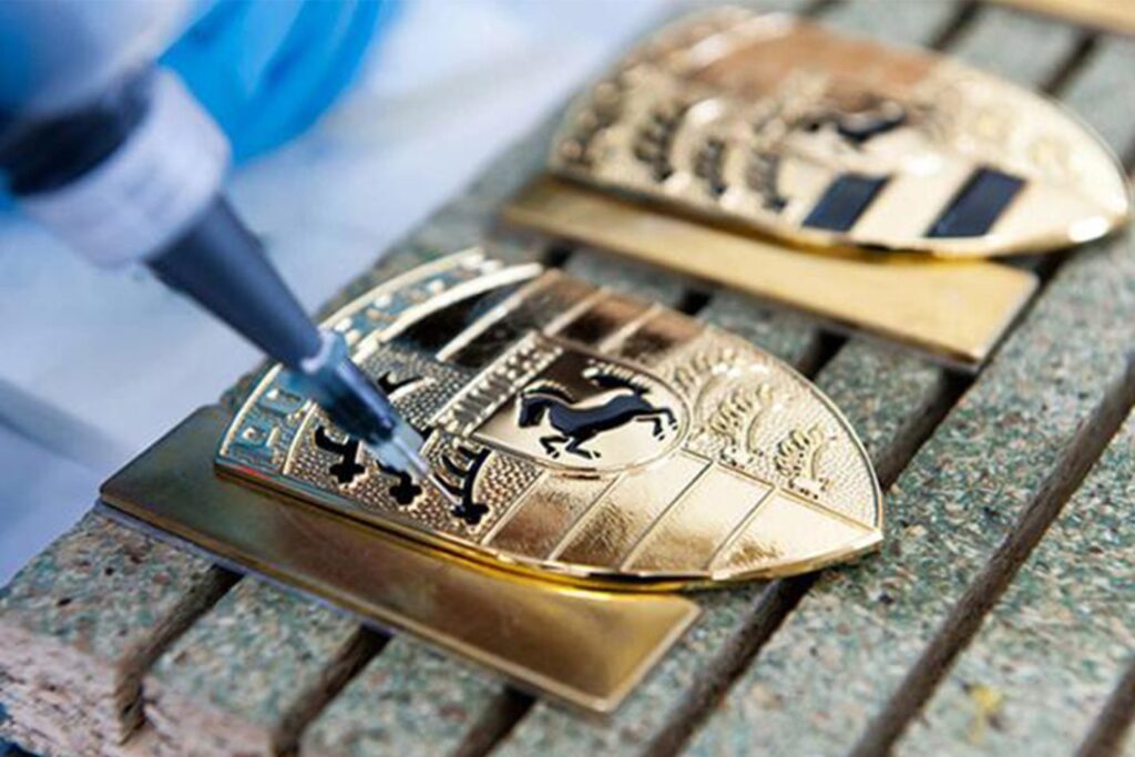 Porsche badges being made