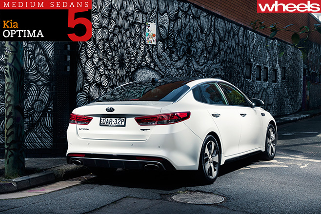 2016-Kia -Optima -driving -rear -side