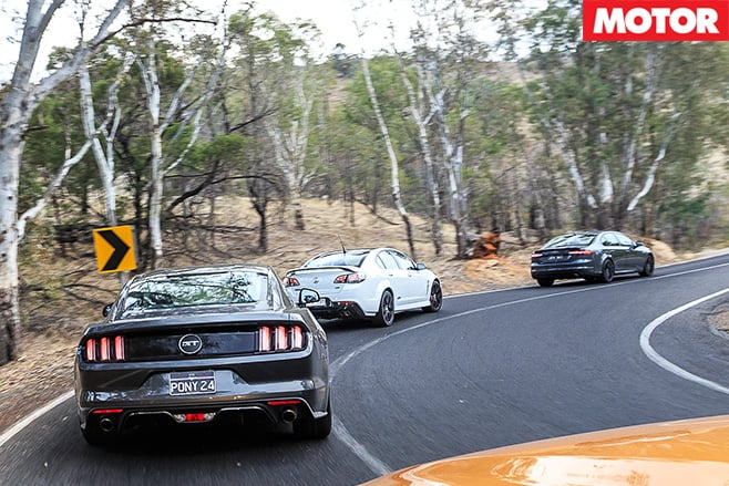 3 modern muscle cars rear driving