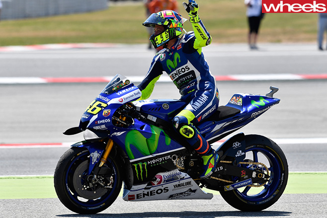 Valentino -Rossi -riding -motorbike -side