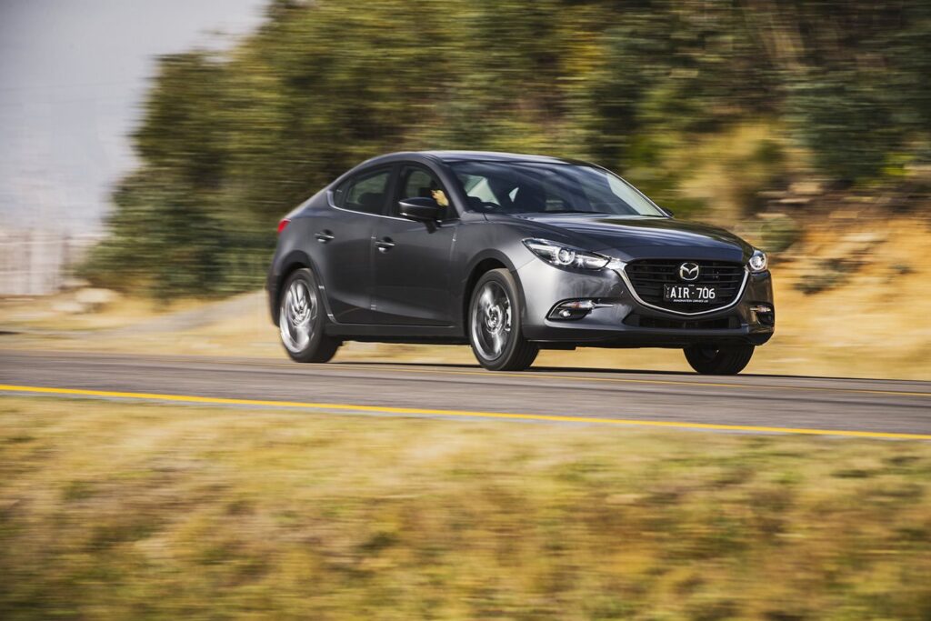 Mazda 3 vs Subaru Impreza: Which small car is best for country driving?