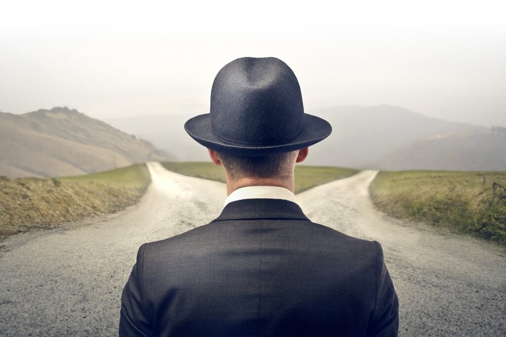Man approaching fork in the road