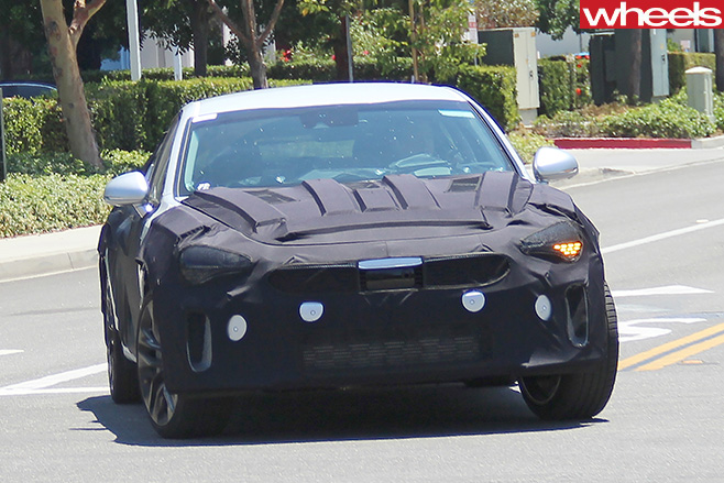 Kia -GT-Sports -Sedan -front -driving