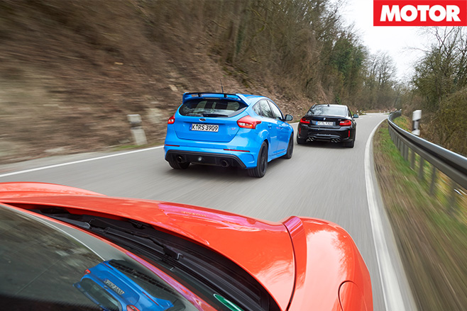 Three cars driving rear