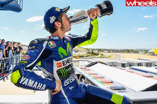 Motogp -Rossi -drinks -from -Cup