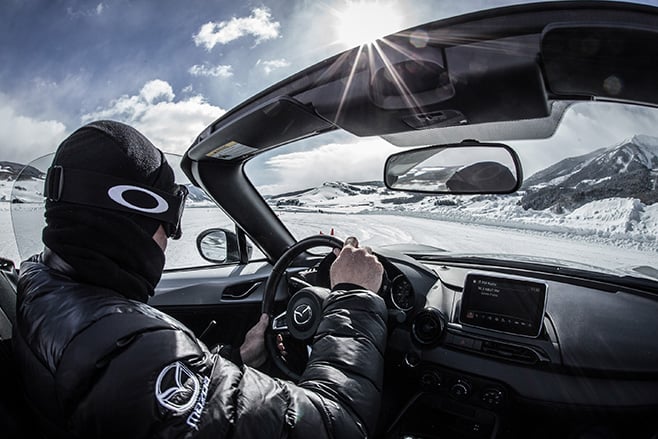 Mazda MX-5 convertible driving snow