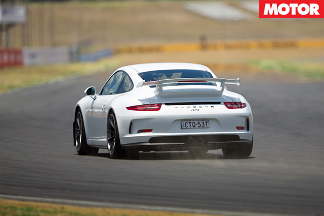 Porsche driving rear