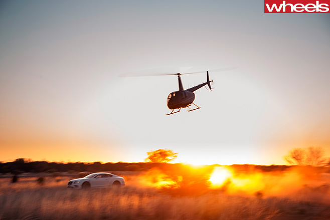 Bentley -continental -GT-driving -on -Stuart -Highway -NT-afternoon -sun