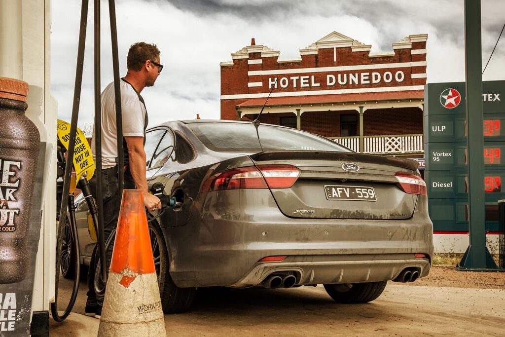 Ford XR8 at fuel station