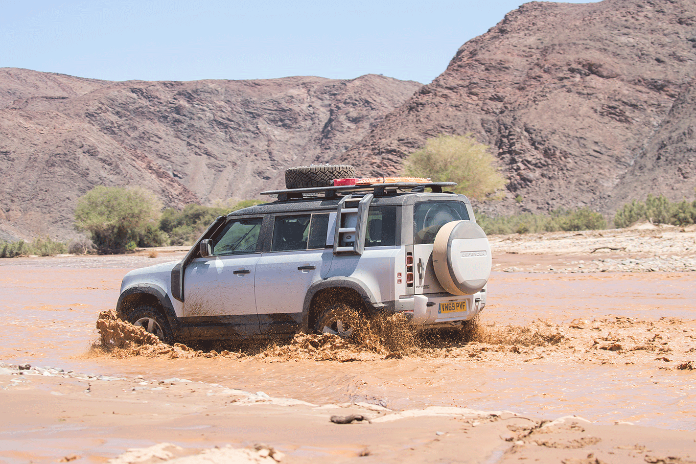 Land Rover Defender crossing river