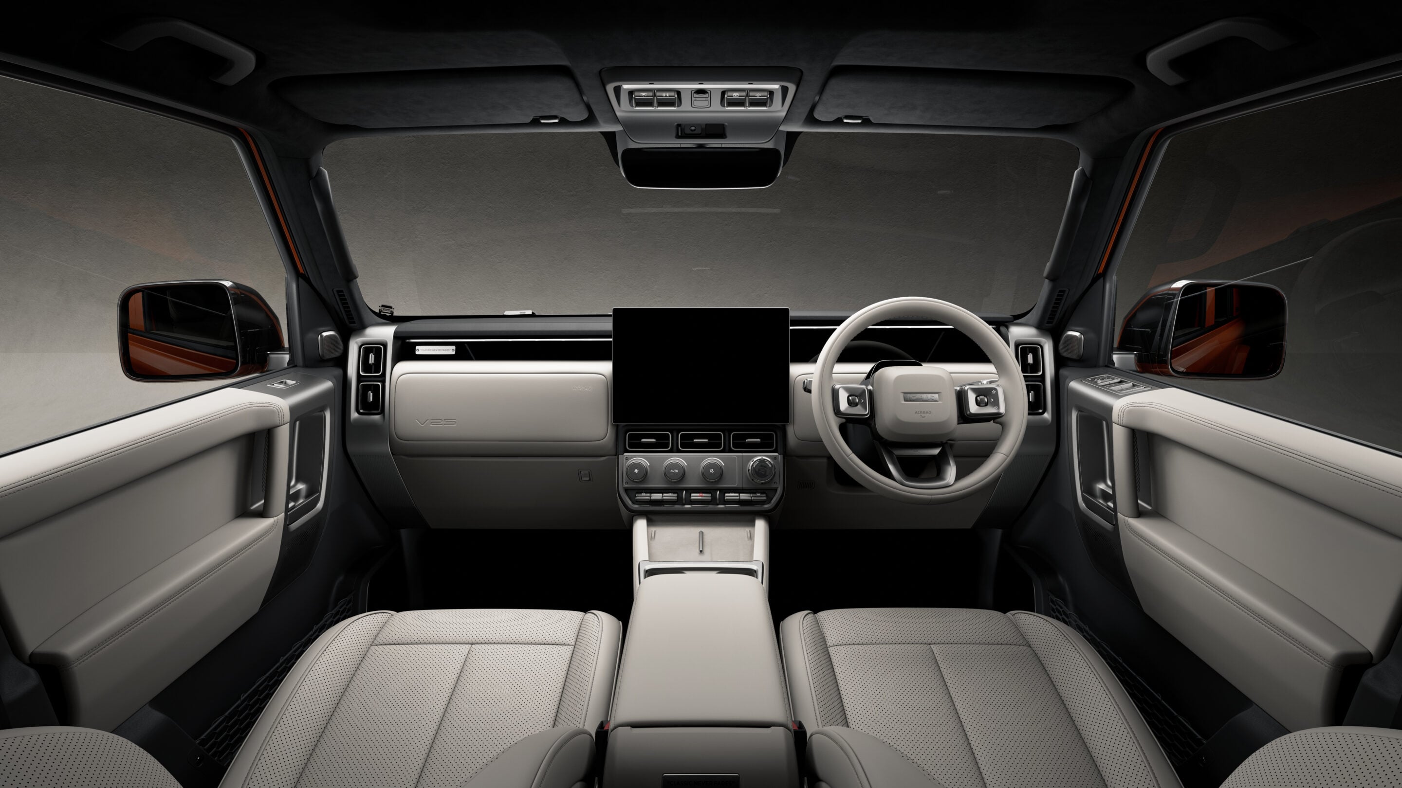 Luxurious SUV cockpit viewed from the back seats, beige leather seats, and a large vertical center touchscreen with a right-hand drive steering wheel visible on the right side of the cabin.