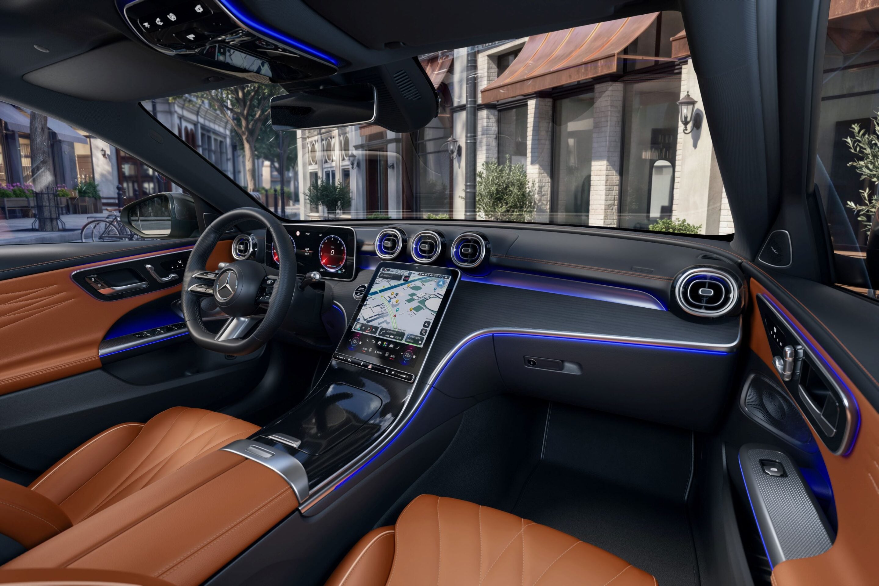 Luxurious car interior with tan leather seats, a digital dashboard, and a center touchscreen showing a map. (Mercedes-Benz interior with blue ambient lighting)