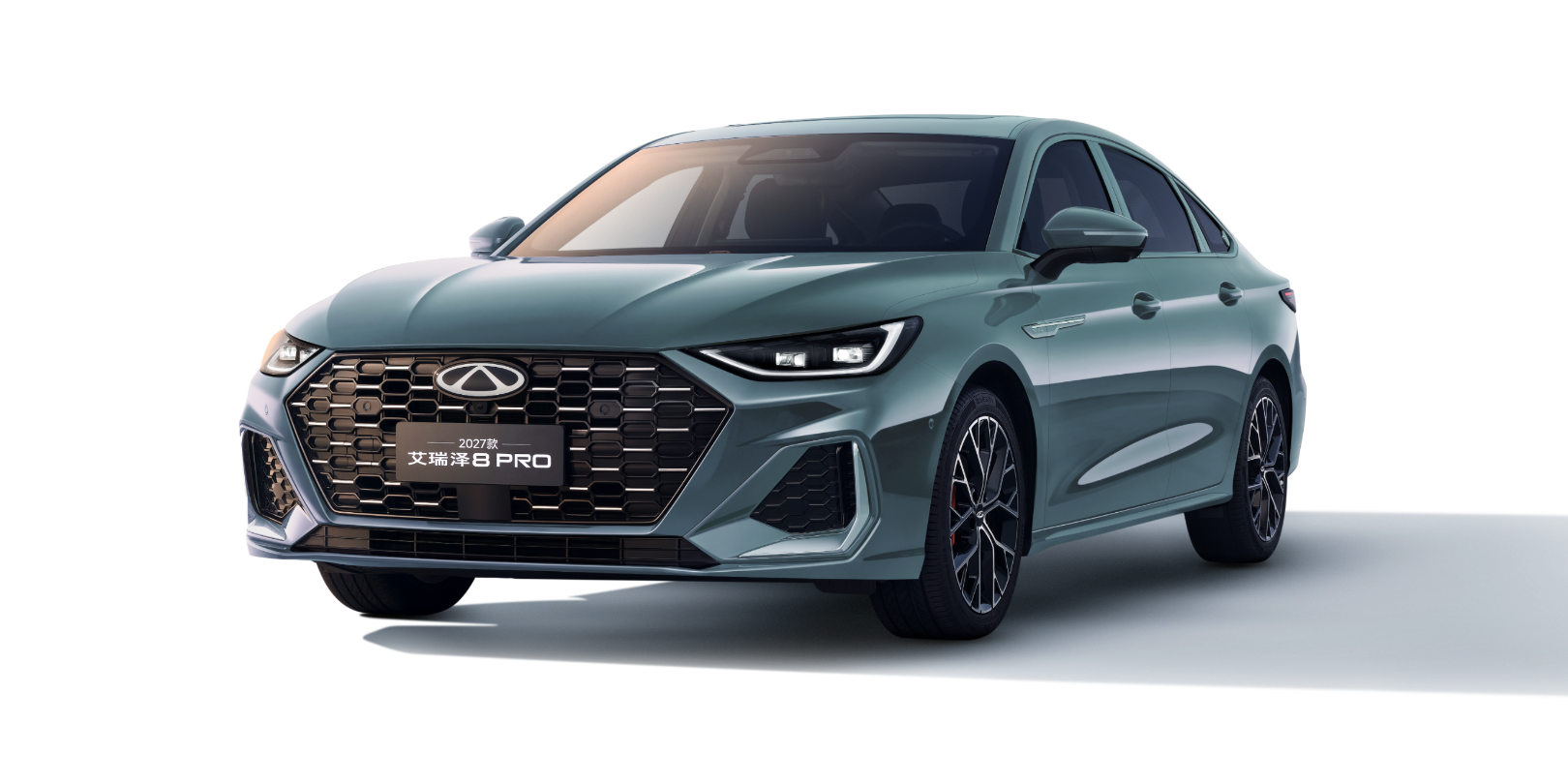 Front three-quarter view of a teal sedan with a large black honeycomb grille, sharp LED headlights, and sporty alloy wheels.