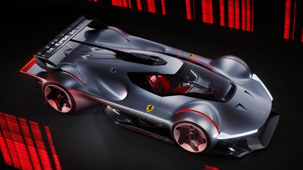 Silver futuristic Ferrari concept race car with red accents, low-slung aerodynamic body and a transparent cockpit.