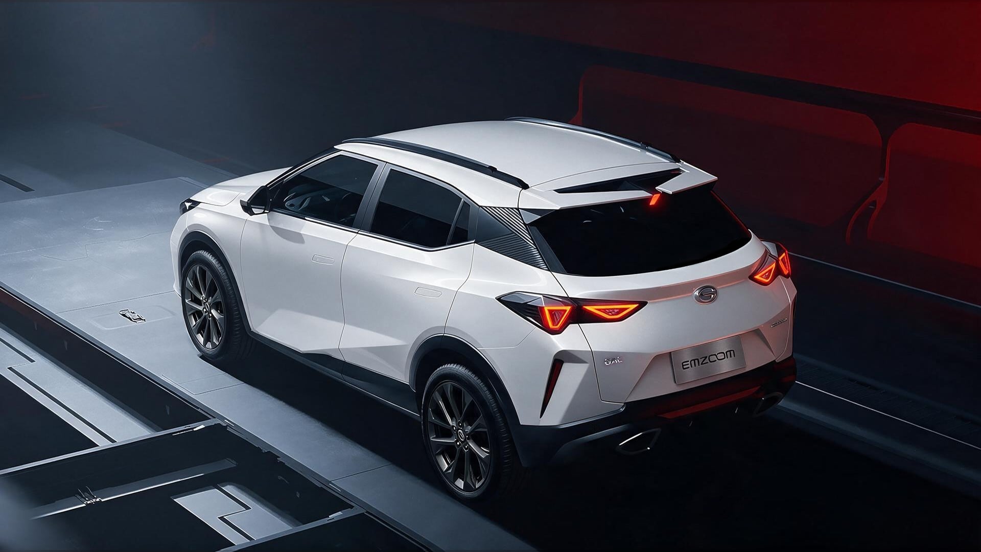 White Emzoom SUV shown from a rear three-quarter angle in a futuristic showroom with red accent lighting and platform lines beneath it.