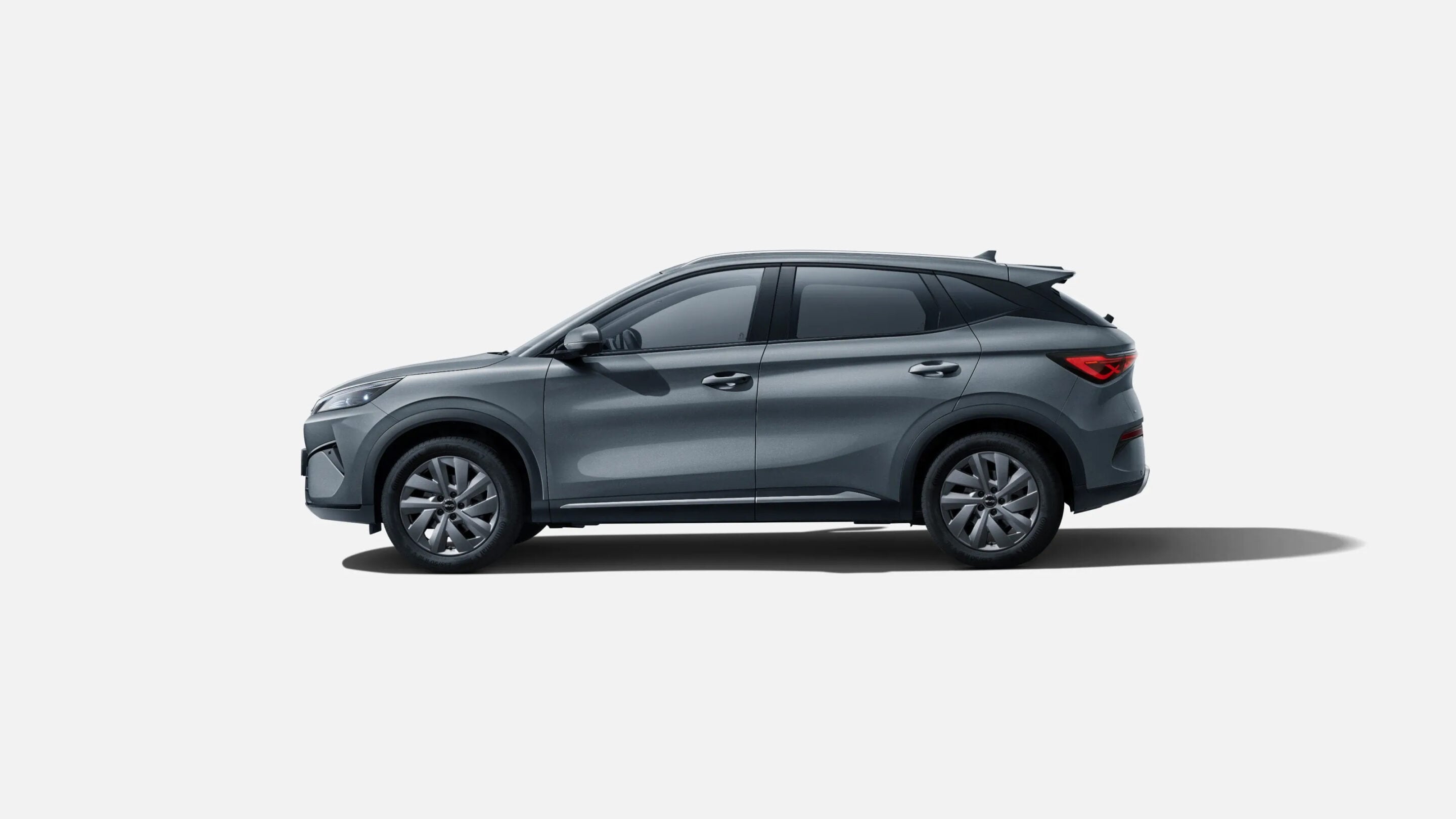 Side profile of a metallic gray SUV viewed from the left on a light background.