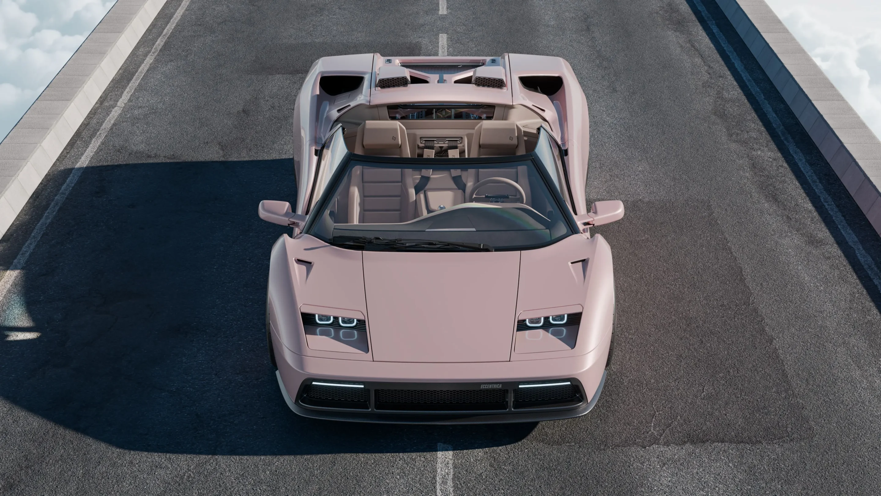 Top-down view of a pink convertible sports car parked on a roadway, with the roof down and beige interior visible.